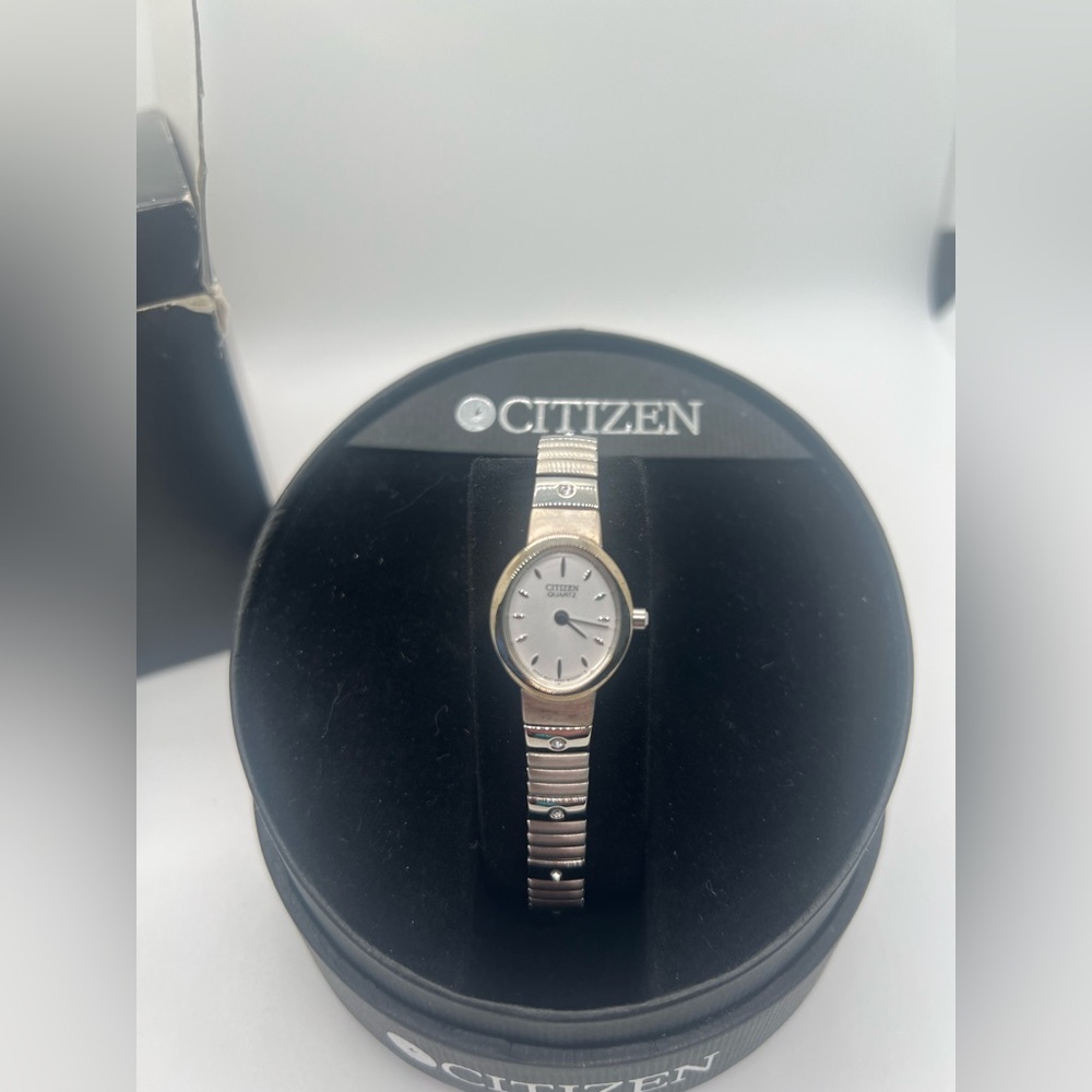 Silver Women's Quartz Watch with Mother of Pearl Face and Roman Numerals Design